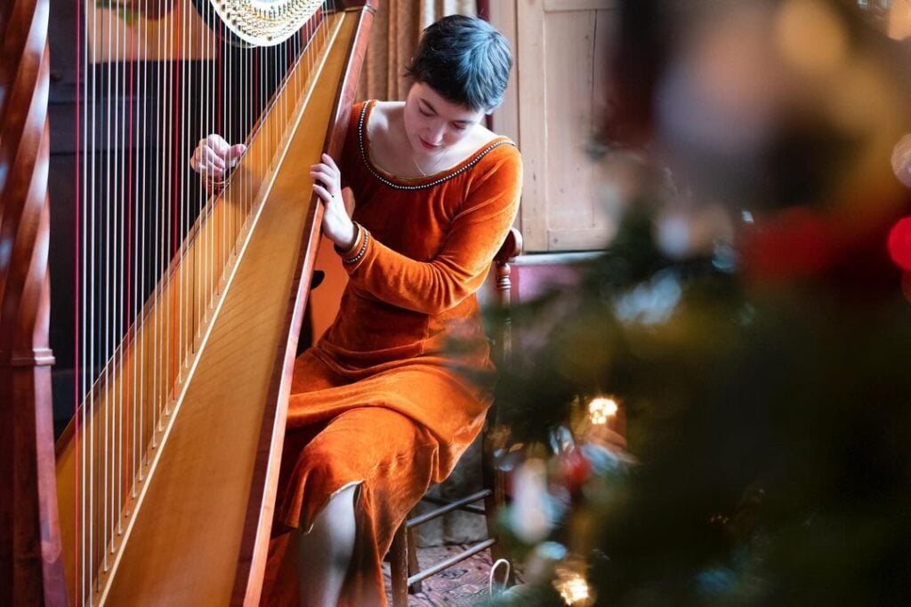 Romany Gilmour playing harp
